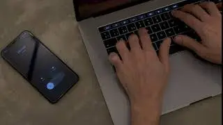 Typing on a Macbook laptop + iPhone | Free stock Mac video