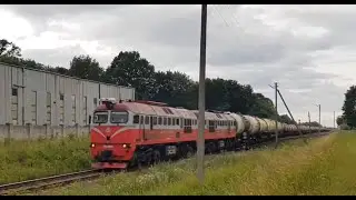 Diesel locomotive 2M62M-0569 with a freight train