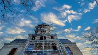 Working at the very top of the chateau .