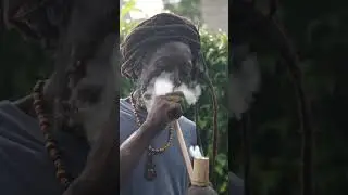 Rasta man smoking his chalice 