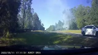 Dashcam - Tree Falls on Powerline... Explodes and lights the woods on fire...