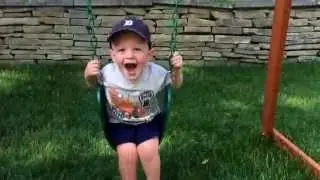 Buddies playing on the swings