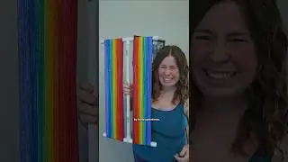 Unraveling a Rainbow Graident Sock Blank on a PVC Pipe Niddy Noddy