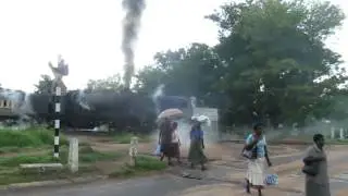 The departure of a 1953 14a  Class Garrett steam engine locomotive.