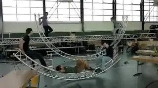 Stagehand relaxing on metal trusses