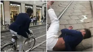 FABRIZIO CORONA CADE DALLA BICICLETTA IN CENTRO A MILANO