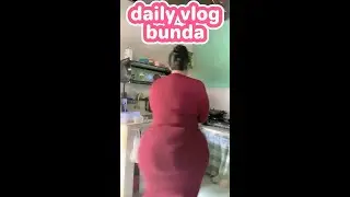 Mother ini the morning at home cooking and washing dishes