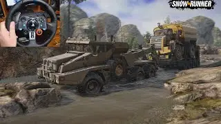 Монстер Sleiter ST 816 буксирует монстра Caterpillar 770G | A Sleiter ST 816 tows a Caterpillar 770G