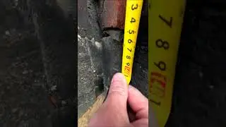 Marks are placed at the corners and in the middle of the building to control the height of the wa...