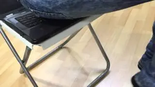 Girl sitting on laptop with jeans