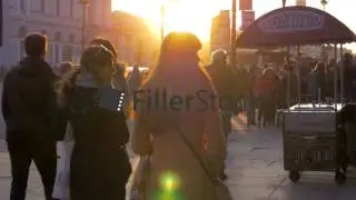 People in the street of Saint Petersburg at sunset