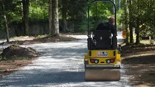 finishing the new drive with a road roller.