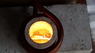 Induction heater melting iron sparks and flames from the intense heat