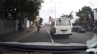 Stupid van driver almost hits a bike