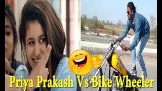 Priya Prakash Vs Bike Wheeler