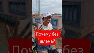 Why does the Thai woman ride without a helmet?