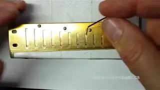 Easy way to support the blow reeds while tuning using a Hockey Stick
