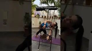 Parivrtta Trikonasana meets innovation using a yoga chair for that extra leverage.