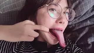 Showing her tongue skills