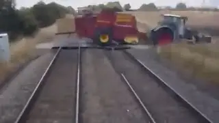 Tractor Moments Away From Being Demolished By Oncoming Train