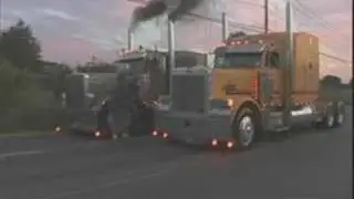 big trucks drag race in traffic