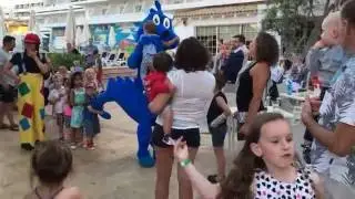 Kids having fun with Coco the mascot