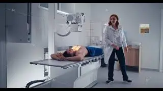 Female doctor doing chest X ray scan of male patient