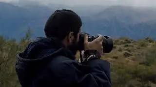 Man Taking Photo Of The Mountains Scenery | Free Stock Footage | Download
