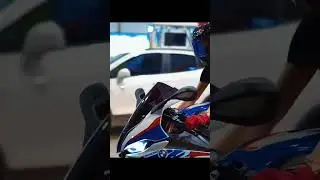 Lady Rider on a BMW S1000RR x AGV Helmet