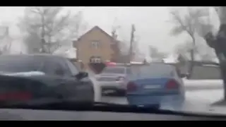 Taxi drives off with cop on hood of car