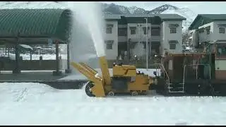 Snow cutter clears snow covered tracks at Banihal station in Jammu and Kashmir
