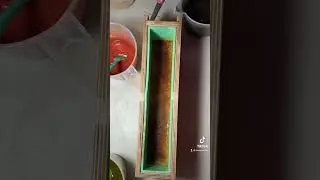 Layered soap bar with pencil lines- cocoa powder, indigo + annatto seed (green), rhubarb root.