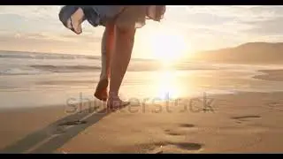 Slow motion woman feet walking barefoot California, USA. Woman in beautiful waving dress at sunset