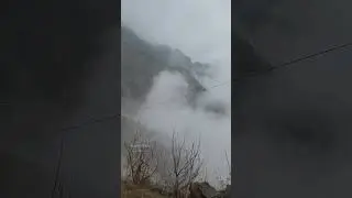 Cloud Kissing the Mountain with It's Playful Bliss