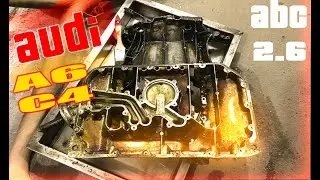 Replacing the oil pan gaskets on an Audi A6 C4 2.6 ABC. Do-it-yourself Audi repair in the garage.