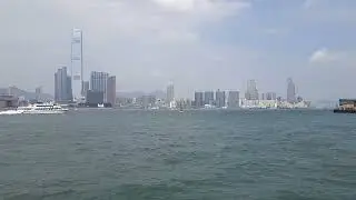 Hong Kong Island, you can see ferry in sea and Victoria Harbour on the other side