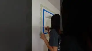 painting a scalloped frame in my bar area! // my fruit themed dining room