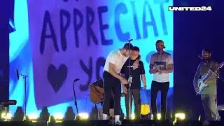 Hero of Imagine Dragons' Video on Stage with Them