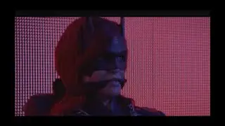 Batwomen captured, chained to chair and cleave gagged.