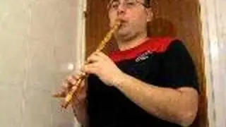 Ahmet Akarsu playing kaval at home
