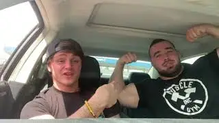 Swole Jamie Tyler Flexes his massive muscles in a car.