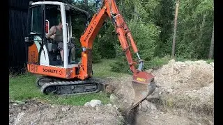 Terex Schaeff HR12 back filling a pit