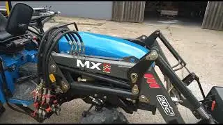 New Holland TC21D Compact Tractor w/MX 20C+ Front Loader with Bucket and Muck Fork