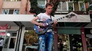 Street busker plays Godfather / Gypsy Jazz