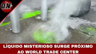 Líquido verde-fluorescente escorre por sarjeta próxima ao World Trade Center