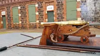 The firing of an eighth scale English 12 Pounder naval gun.