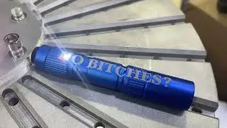 Bad words on an anodized aluminum flashlight - fiber laser
