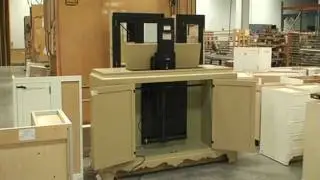 Remote control TV lift installed in a base cabinet - doors open