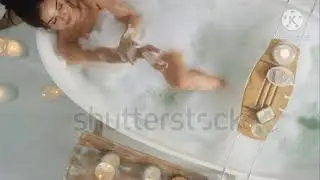 a girl wathing in tub