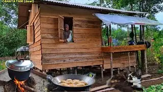 Under heavy rain in a forest hut, making fried bread, cooking garden produce, living in the fores...